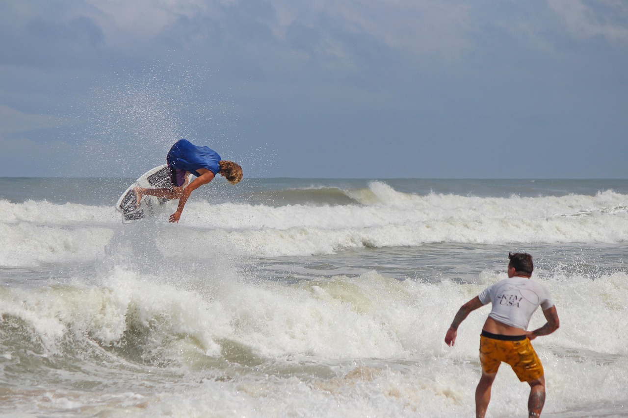 two people skimboarding in outer banks north carolina is perfect for north carolina outdoor adventure