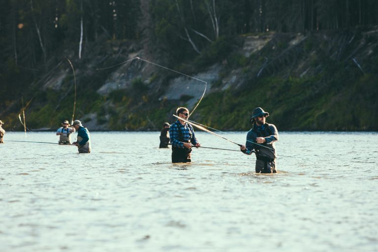 Men fly fishing in alaska