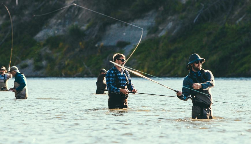 Men fly fishing in alaska