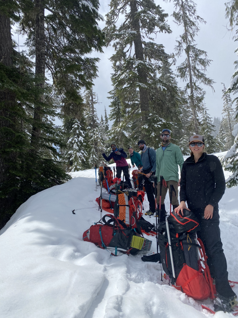 group of mountaineers smiling on a climbing trip