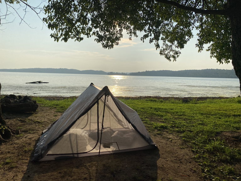 tent camping on the edge of a lake