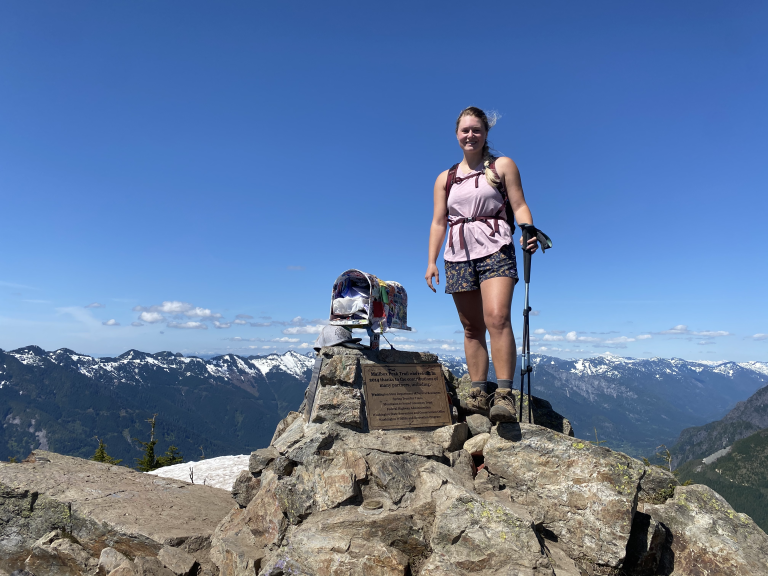 women climbing at top of mailbox peak in Washington on day hike