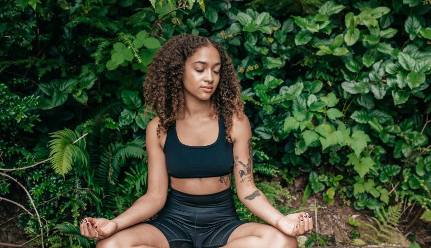 women in woods enjoying benefits of forest bathing