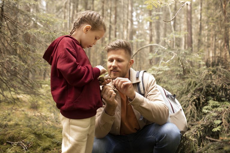 outdoorsy dad with daughter on fathers day in the woods